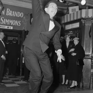 Norman Wisdom seen here waving to the crowds at the premiere of Guys Norman Wisdom seen here waving to the crowds at the premiere of Guys