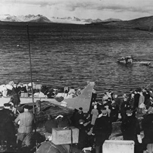 Norwegians being evacuated along with their luggage from the Svalbard Islands late one