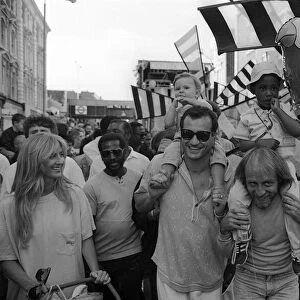 Notting Hill Carnival August 1987 Men, women and children enjopy the festival
