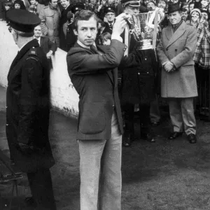 Nottingham Forest captain John McGovern shows off the League cup trophy to the crowd Nottingham Forest captain John McGovern shows off the League cup trophy to the crowd