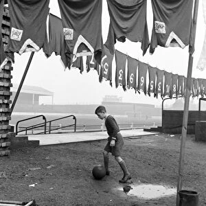 Nottingham Forest training session. Young boy practicing his ball skills underneath