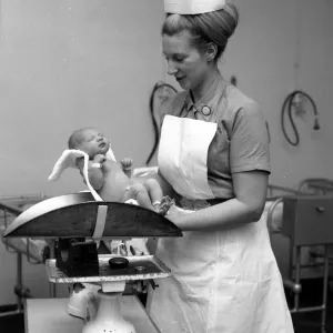 Nurse Anne Stewart with first new born babies of the year at Queen Charlotte