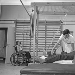 A nurse demonstrates how a sling for a broken leg works during a open day at the Chester
