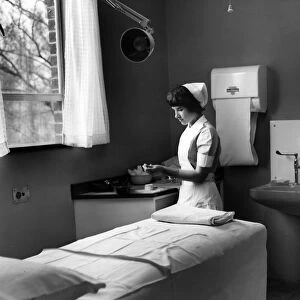 Nurse Phoebe Barrett, aged 22, in one of the consultant examination rooms at Birmingham