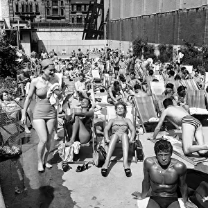 The Oasis Lido Pool, Endell Street, London was almost crowded to capacity with men