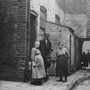 The occupiers of No 3 Court, Clayton Street, Liverpool, with their canary. 2nd March 1933