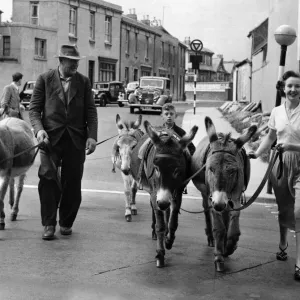 Off to the beach: Mrs. Walsh with Mr. Smith, the donkey man. August 1954 P011888