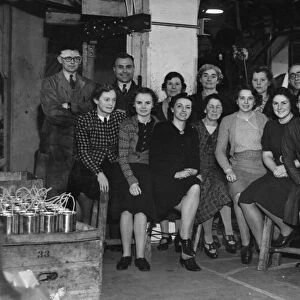 Some of the office staff of a local Tin Box factory, making collecting boxes for the red