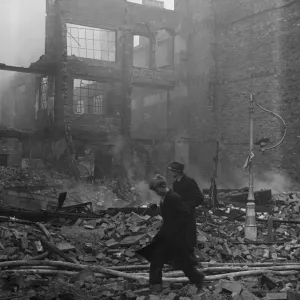 Office workers negotiate the rubble strewn Smallbrook Street, Birmingham