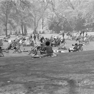 Office workers and young families enjoy the spring warmth and sun in St James Park Office workers and young families enjoy the spring warmth and sun in St James Park