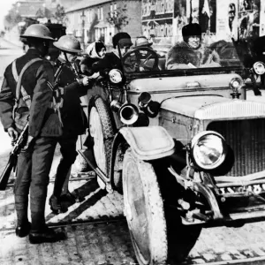 Officers examining the licence of a lady motorist in Dublin. October 1920 Officers examining the licence of a lady motorist in Dublin. October 1920