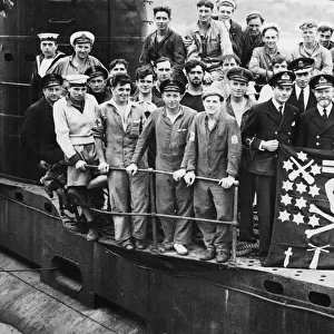 Officers and sailors of the British Submarine Ultor displaying their Jolly Roger which