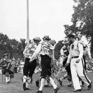 Print of The Old English Folk Dance Society performing the sword dance at Stratford Upon Avon, 1948 Print of The Old English Folk Dance Society performing the sword dance at Stratford Upon Avon, 1948