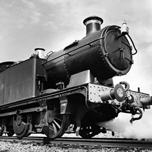 An old Leamington steam locomotive number 6697 being preapred for action at Didcot