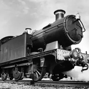 An old Leamington steam locomotive number 6697 being preapred for action at Didcot
