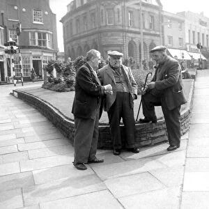 Three old men putting the world to right in the town centre of Stourbridge