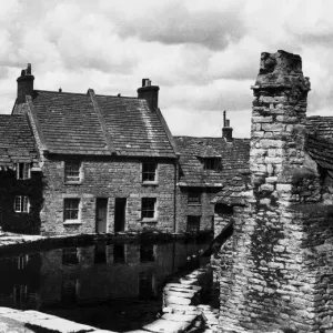 The Old Mill Pond Swanage, Dorset. Note the old chimney built on to the cottage in The Old Mill Pond Swanage, Dorset. Note the old chimney built on to the cottage in
