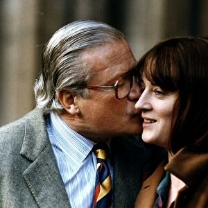 Oliver Reed Actor kissing wife Josephine on check