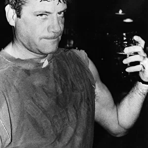 Oliver Reed British actor in pub with beer glass 1979