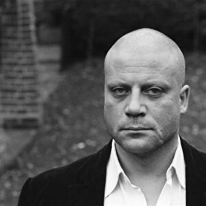 Oliver Reed not wearing his wig at his home in Wimbledon, South West, London