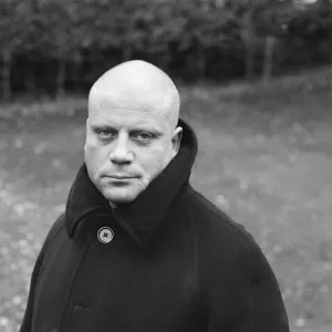 Oliver Reed not wearing his wig at his home in Wimbledon, South West, London