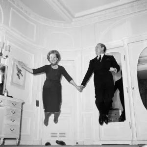 Olivia De Havilland playing a jumping game with her husband Pierre Galante Olivia De Havilland playing a jumping game with her husband Pierre Galante