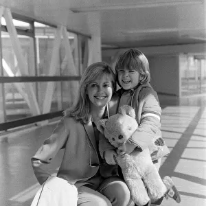 Olivia Newton John departing Heathrow Airport with her nephew Emerson. 23rd March 1979