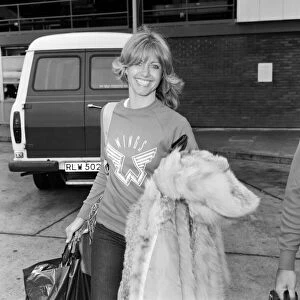Olivia Newton John leaving Heathrow Airport for Los Angeles. 9th June 1977