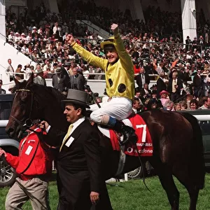 Olivier Peslier Jockey celebrates after winning the race on High Rise Racehorse as he is