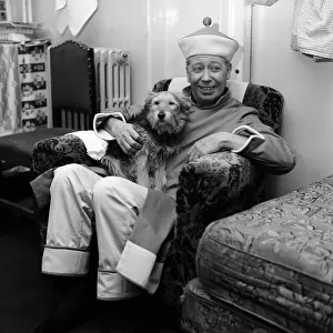 The show must go on, says George Formby, appearing as Mr Wu in Aladdin