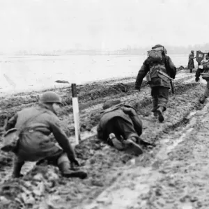 Print of British troops advancing through snow-covered terrain near Sittard
