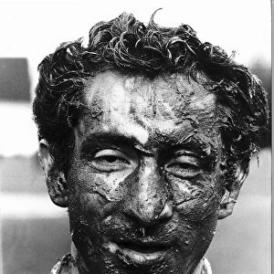 Ossie Ardiles football player covered in mud. March 1982