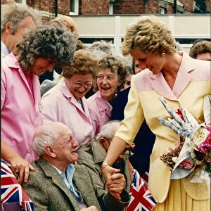 Overcome with emotion, Mr Rossiter Miller receives a comforting hand from Princess Diana