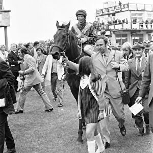 Owner Frank Spencer leads in Fiery Coin and jockey Cliffe Parkes after winning the Andy