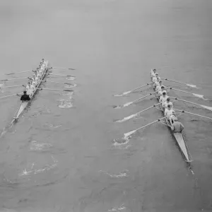 Oxford (Left) edge into the lead against Cambridge in the 100th University boat race