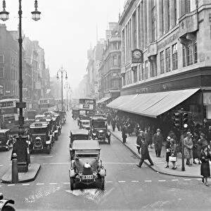 Oxford Street, London. A busy scene with cars and pedestrians