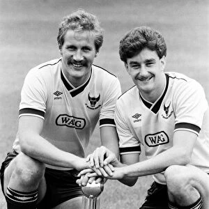 Oxford United footballer John Aldridge (right) with teammate hold the Second Division