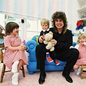 Ozzy Osbourne at home in 1988 with his children (l-r, Aimee