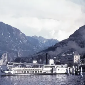 The paddle steamer Sempione arrives at Gandria Village, Lake Lugano The paddle steamer Sempione arrives at Gandria Village, Lake Lugano