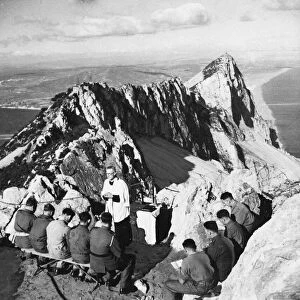 A Padre holding Communion in the mountains for soldiers. 24th March 1943