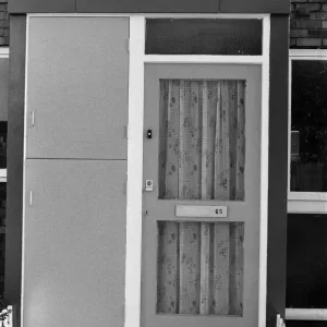 Painted council houses and the unpainted ones - part of a battle of home buying at a Painted council houses and the unpainted ones - part of a battle of home buying at a