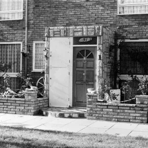 Painted council houses and the unpainted ones - part of a battle of home buying at a Painted council houses and the unpainted ones - part of a battle of home buying at a