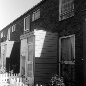 Painted council houses and the unpainted ones - part of a battle of home buying at a Painted council houses and the unpainted ones - part of a battle of home buying at a