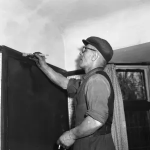 Painter and decorater seen here at work circa April 1959