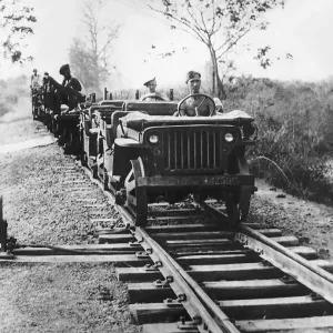 A pair of Willys Jeeps adapted for running on railway tracks head southwards