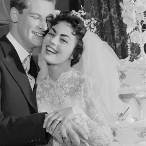 Pamela and David Moore cut the cake at their reception. Pamela was the Daily Mirror Pamela and David Moore cut the cake at their reception. Pamela was the Daily Mirror