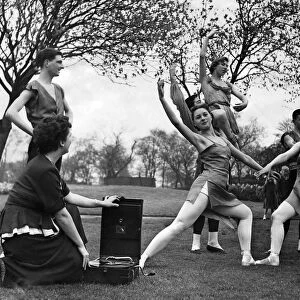 Pamela Leatherland seated by the gramophone, watches her team perform the ballet "