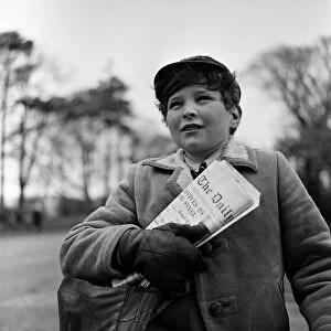 Paperboy Alan Preston delivering the Daily Telegraph in Lytham St Annes, Lancashire