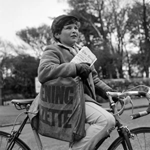 Paperboy Alan Preston delivering the Daily Telegraph in Lytham St Annes, Lancashire