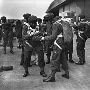 Paratroop Training at RAF Ringway, Manchester. England. Paratroopers checking each
